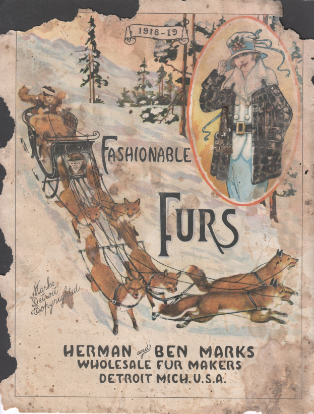 Ein altes Buch mit einem Coverbild einer Frau in einem von Tieren gezogenen Schlitten, umgeben von Bäumen, betitelt mit "Fashionable Furs by Herman and Ben Marks".