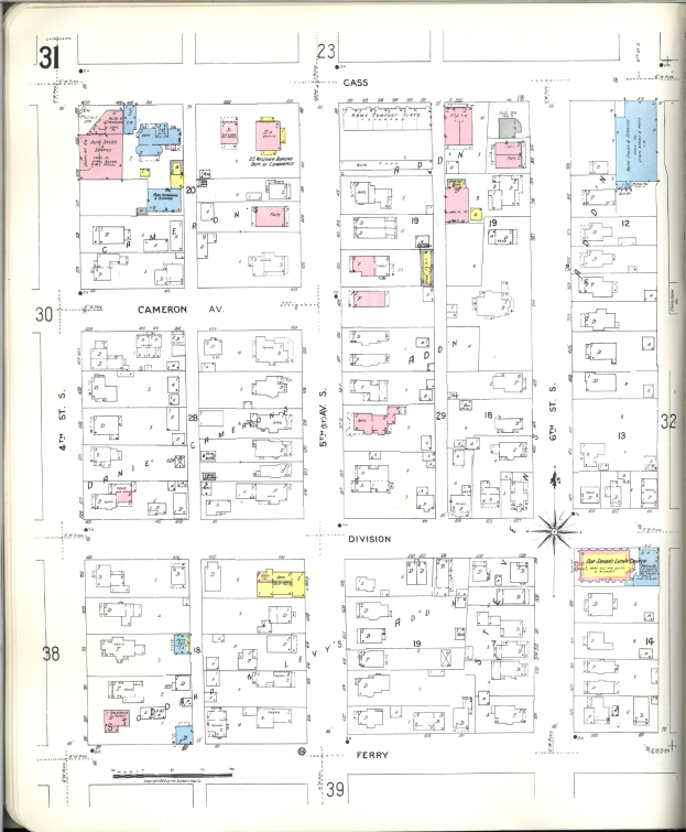 Altes Buch mit einer Stadtkarte aus den 1920er Jahren auf dem Cover, das Straßen, Gebäude, Parks und Sehenswürdigkeiten zeigt.